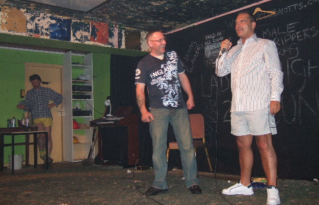 Comedian Frankie Allen on stage at the Radford Variety Club Notts with a member of the audience.